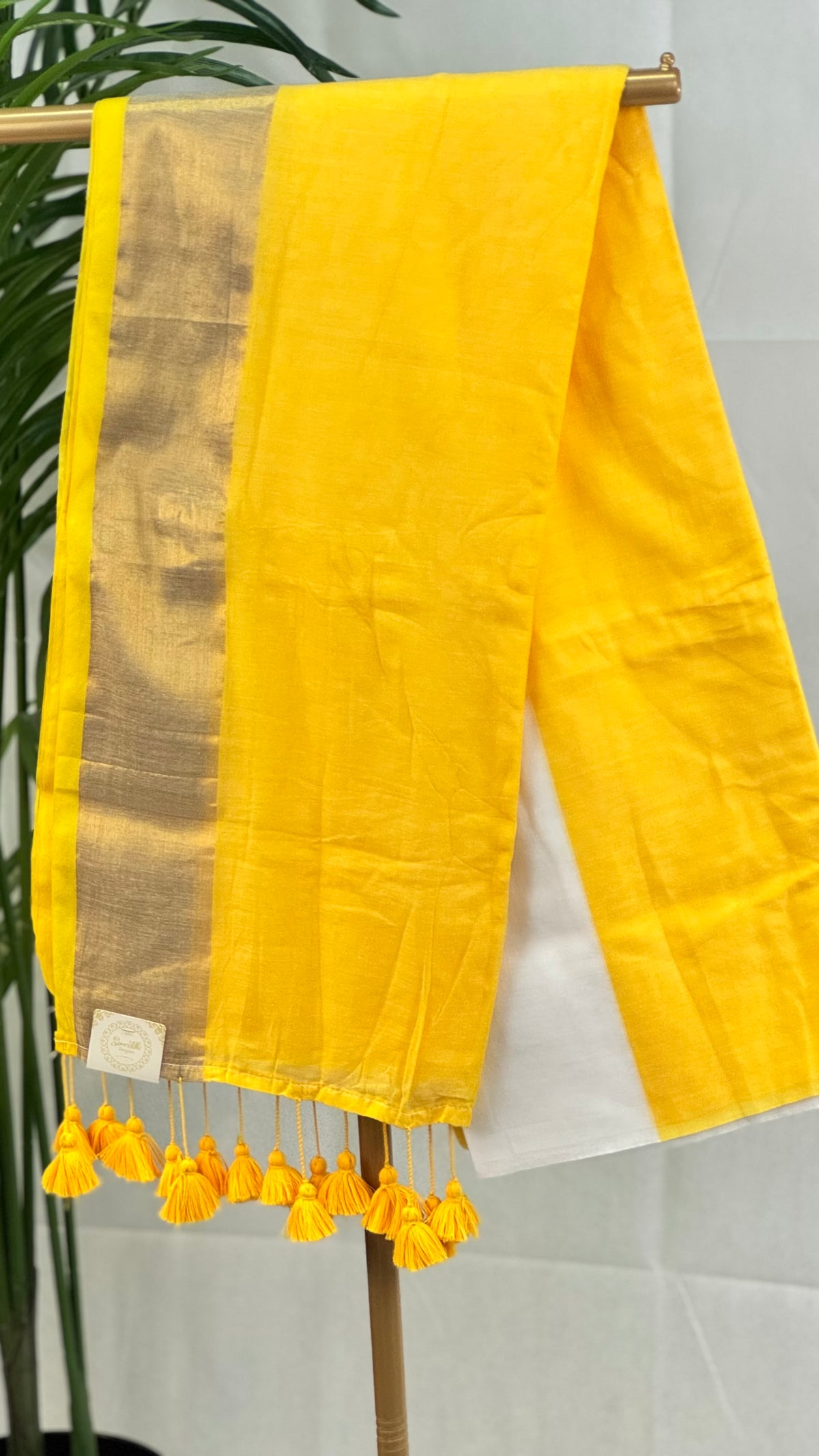 Surya Rekha-Yellow & White Mul Cotton saree with zari border tassels